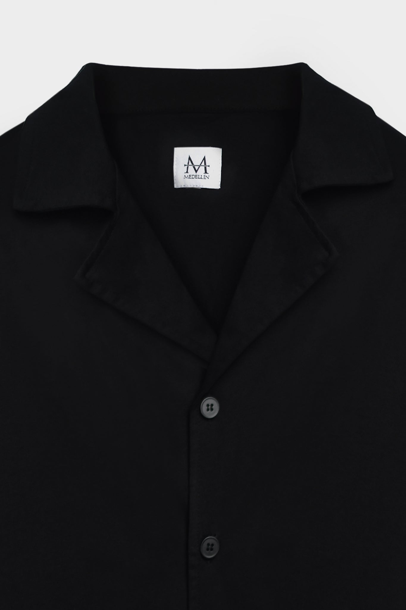 Load image into Gallery viewer, black collar shirt with medellin logo