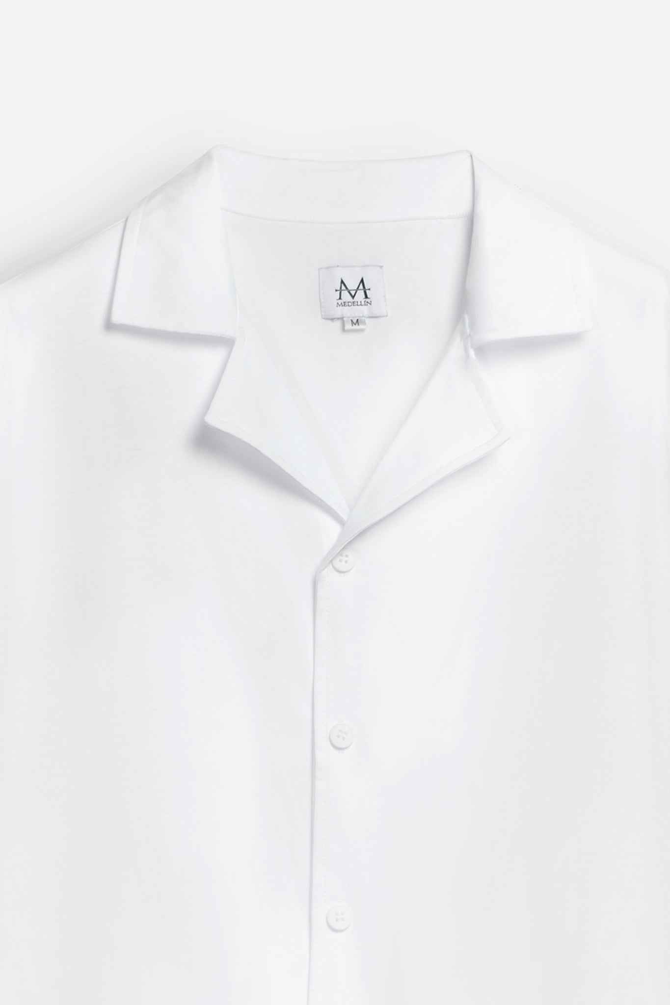 Load image into Gallery viewer, white collar shirt with 'M' logo