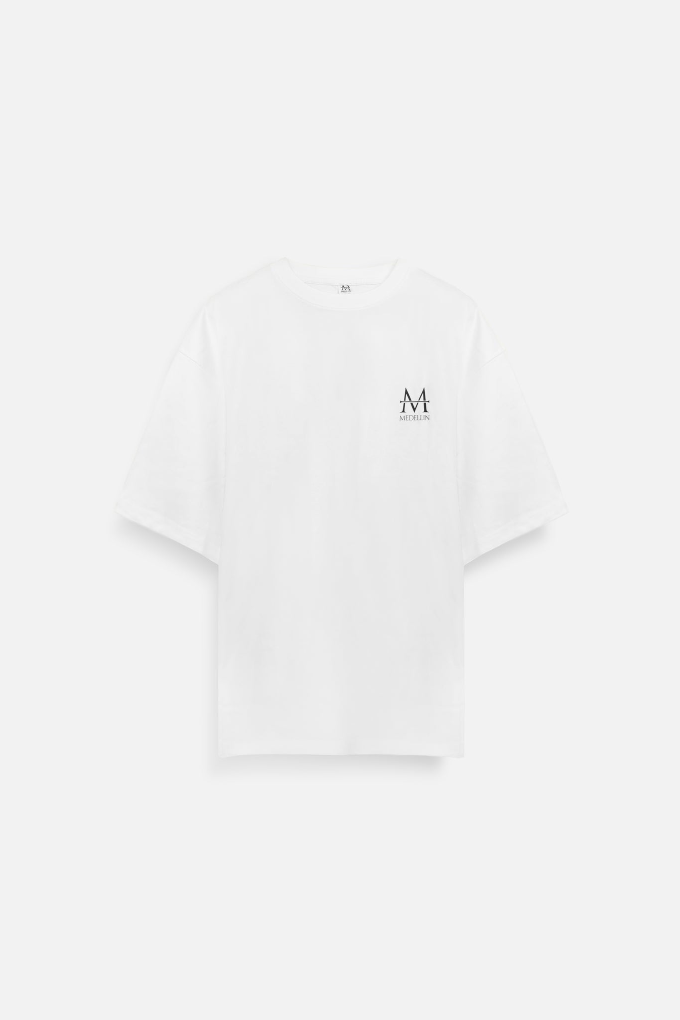 Load image into Gallery viewer, White t-shirt with a medellin logo